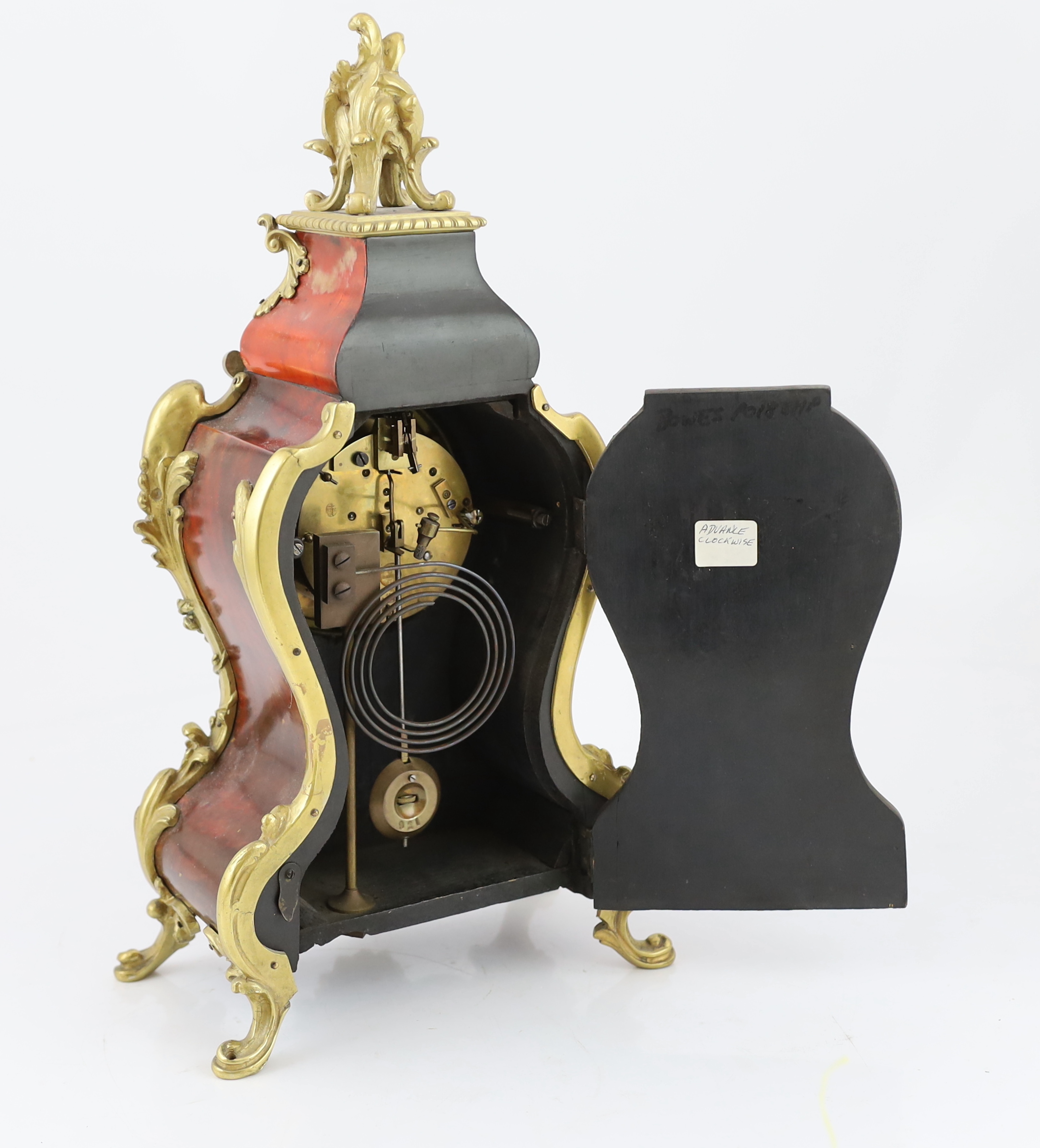 An early 20th century French ormolu mounted red tortoiseshell eight day mantel clock, 22cm wide, 12cm deep, 40cm high